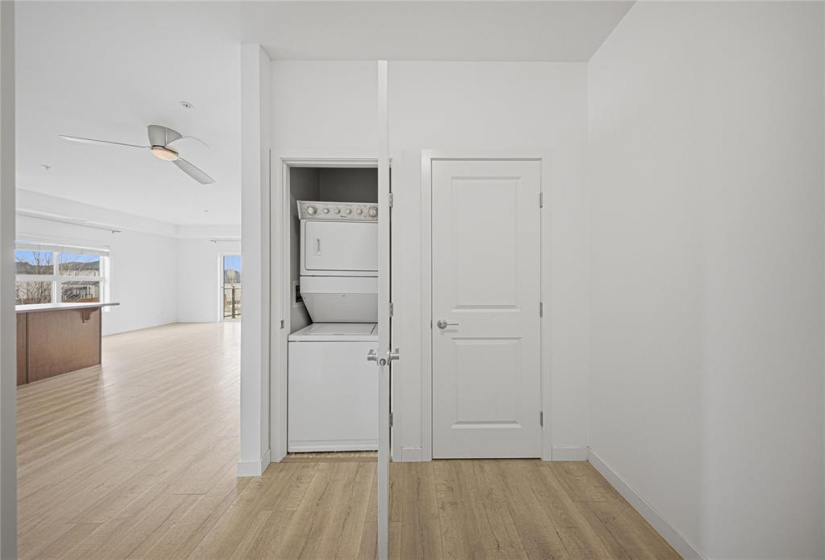 Insuite laundry beside storage , across from the coat closet