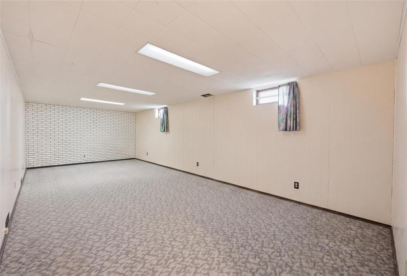 Huge rec room area. Photo enhanced using AI for illustrative purposes.