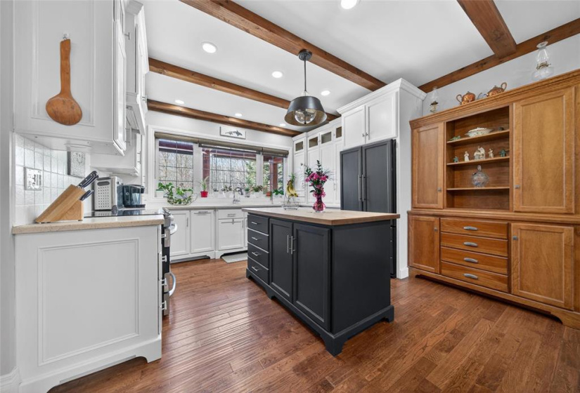 Kitchen with butcher block island.