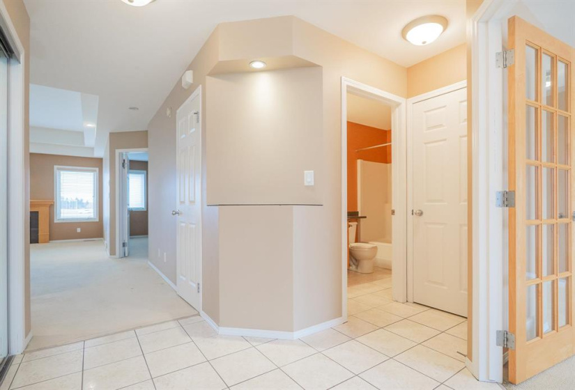 Spacious front entry with ceramic tile and closet
