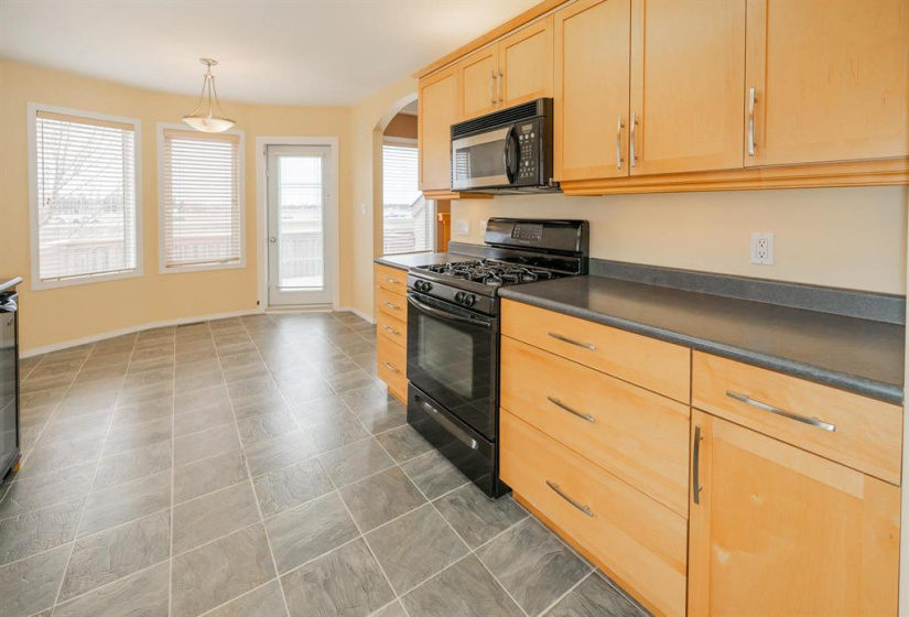 Maple cabinets with ambient lighting above and task lighting below.