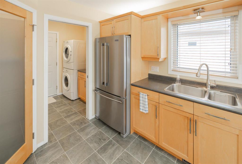 Endless counter space and cabinets with corner pantry and main floor laundry area