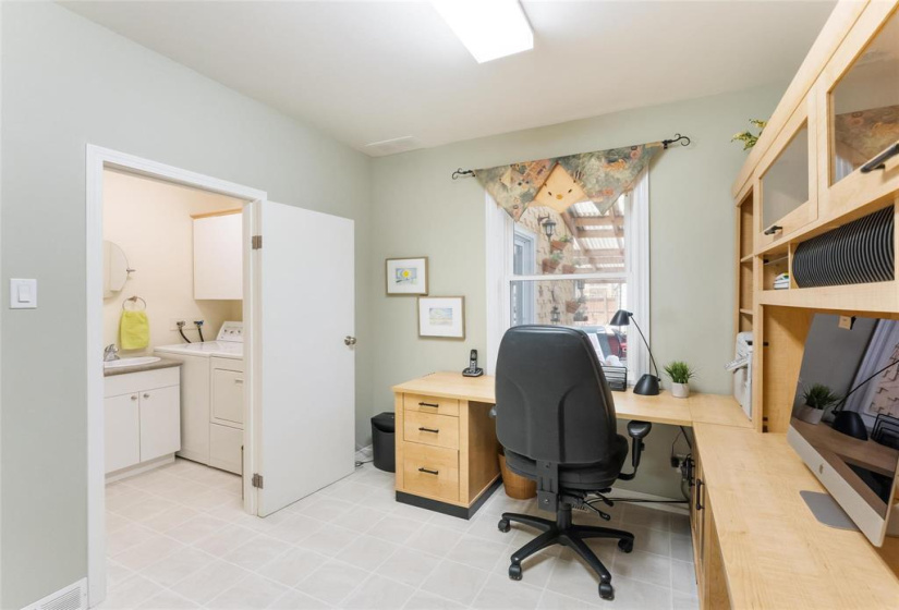Main floor laundry with 2 piece bathroom off the office