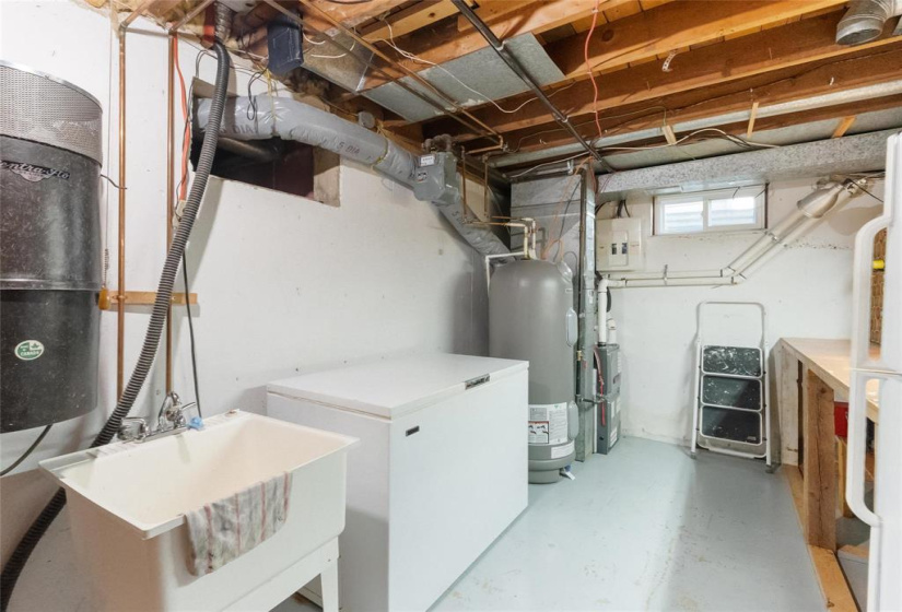 Freezer and laundry sink included.  Sump pump.