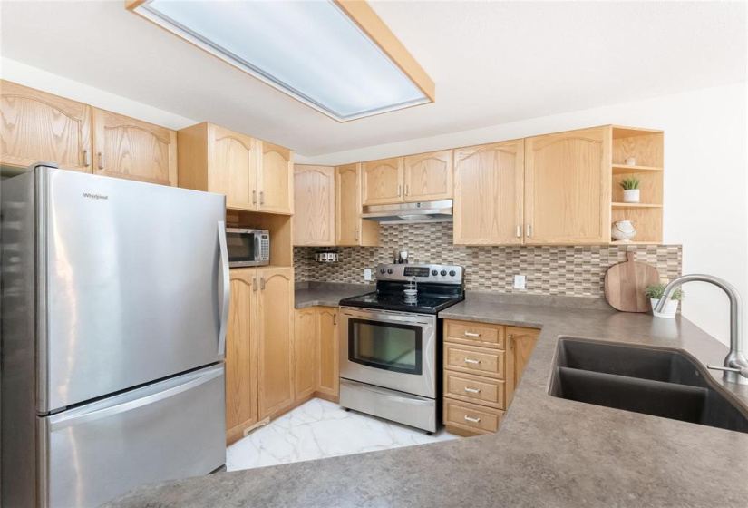 Double sinks and views of the back yard if you choose to do dishes