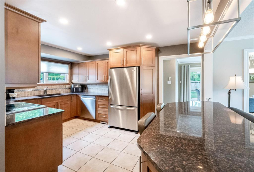 Wonderful kitchen with granite counters, stainless steel appliances, breakfast bar