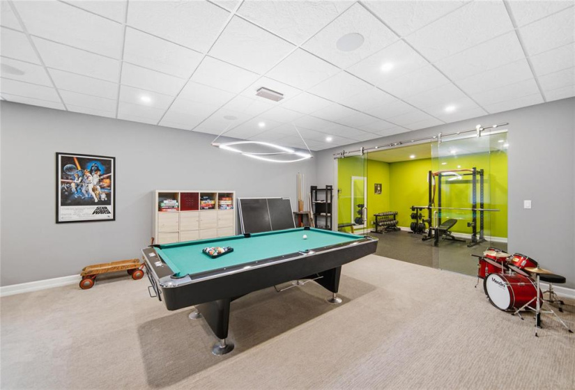 Lower level games area and dedicated home gym