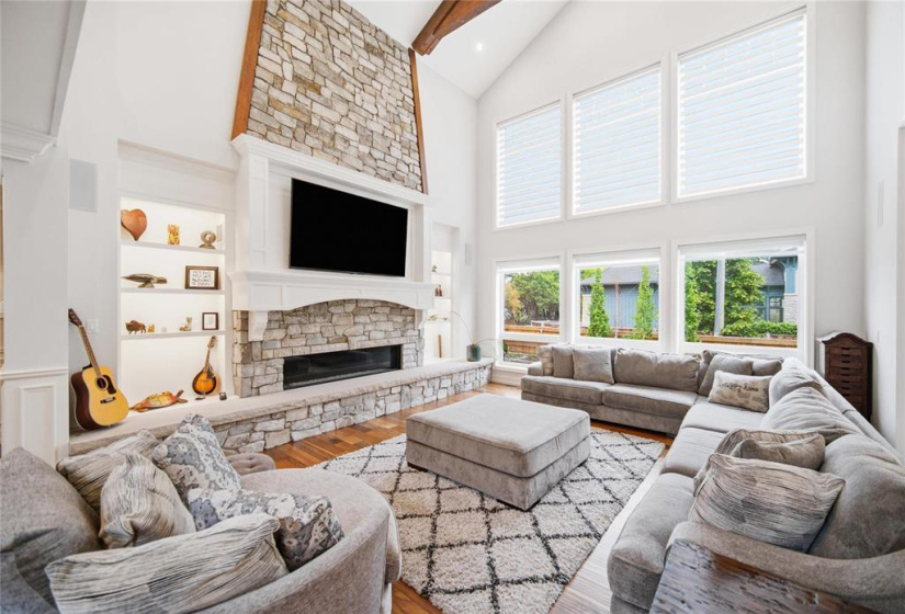 Soaring ceilings, custom millwork, gas fireplace