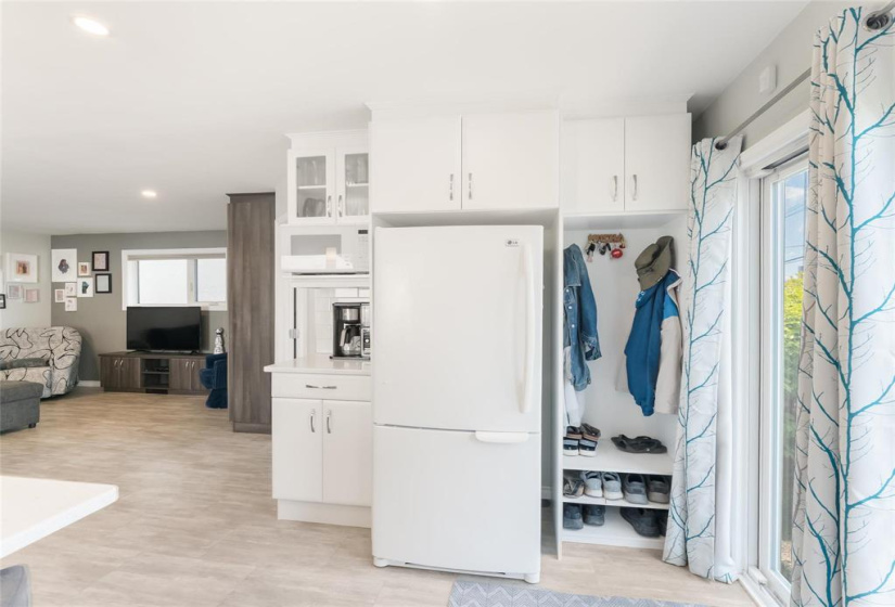 Fridge included. Great coffee bar area. Convenient back coat closet or broom closet