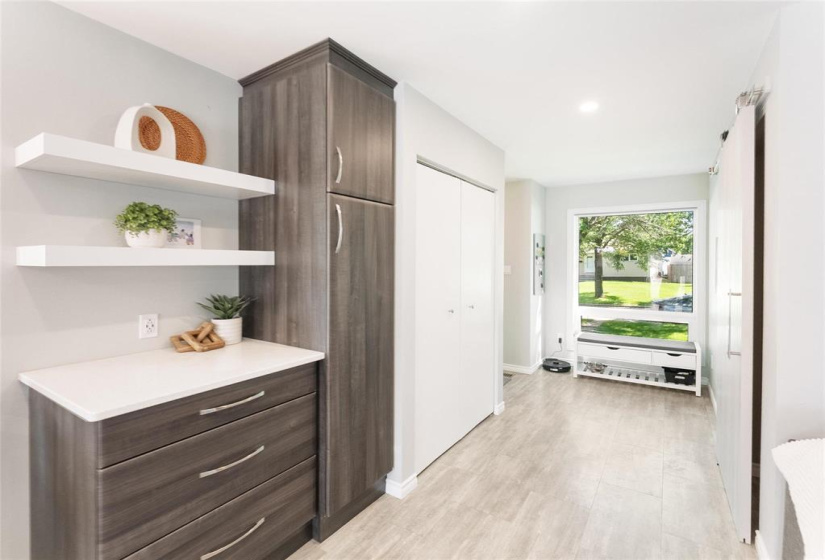 Custom built cabinets, coat closet
