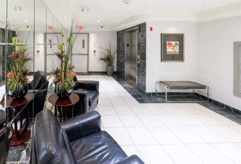 Spacious and bright lobby area where you collect your mail.
