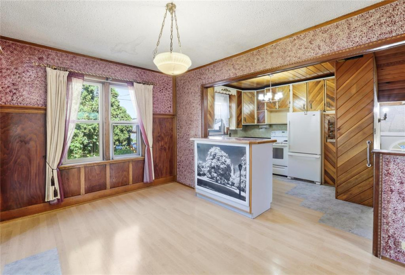 Eating area adjacent the Kit previously a Formal Dining rm with wainscotting & plate rail.
