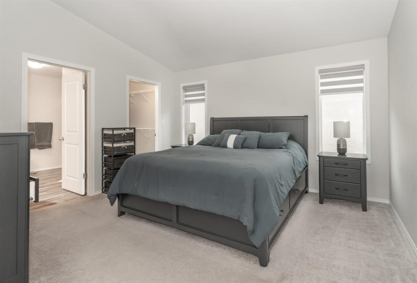 Primary bedroom is fit for a king-sized bedroom suite